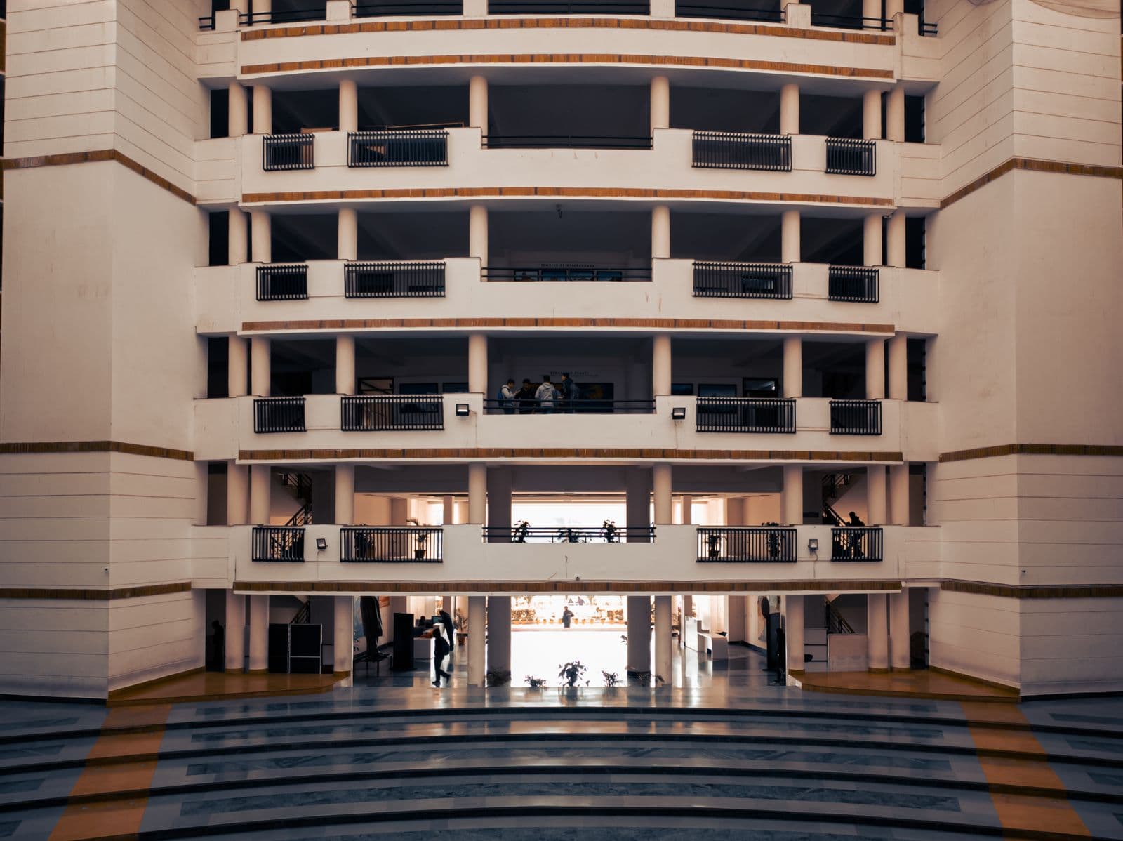 The outside of a college building, seen from across the road